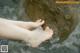 A woman's feet in a body of water.
